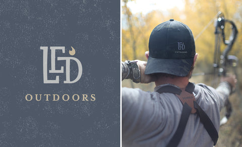 LED Outdoors™ Black Camo Flexfit Trucker